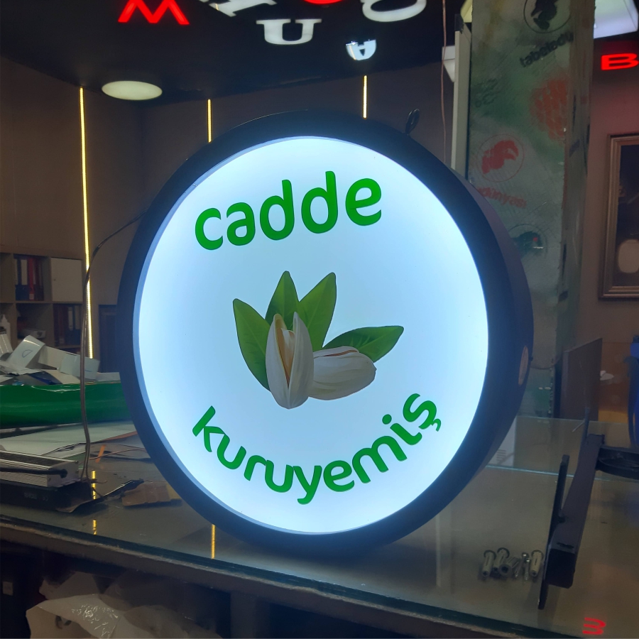 cadde-kuruyemis-isikli-yuvarlak-tabela